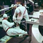 John Pace helps rotate the top of the reactor in order to remove broken pieces of melted fuel rods. The seal around the top of the reactor was cut, allowing radiation to leak from the core of the reactor.